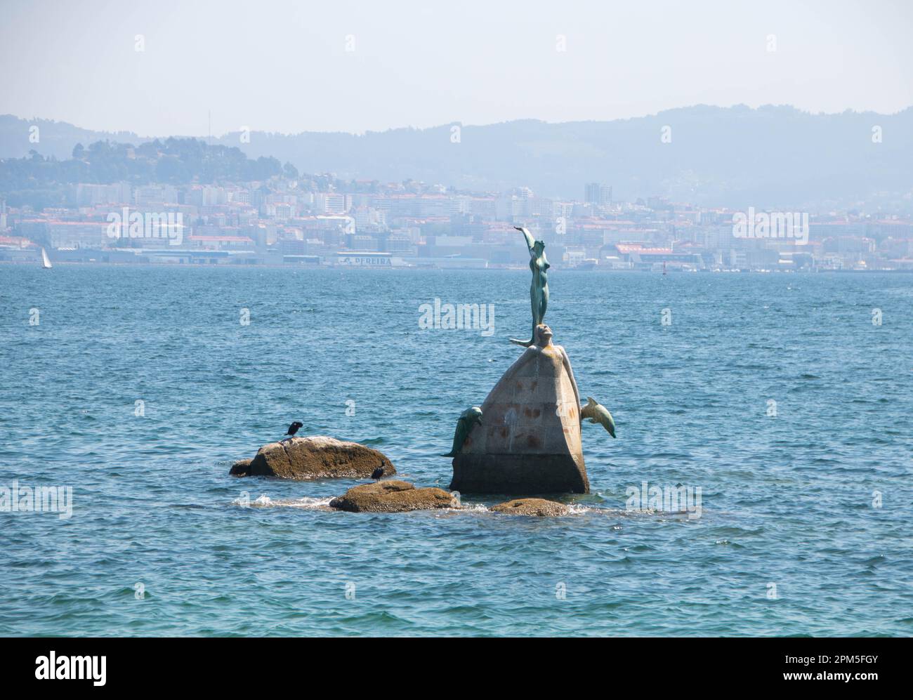 Statue of a mermaid in the water of Cangas Stock Photo