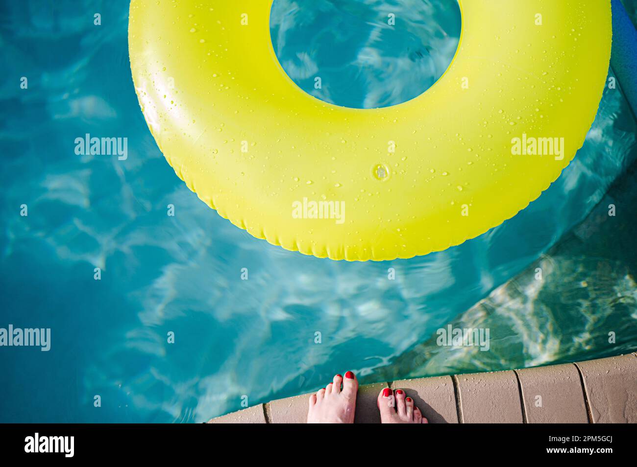 yellow inner tube in pool Stock Photo Alamy