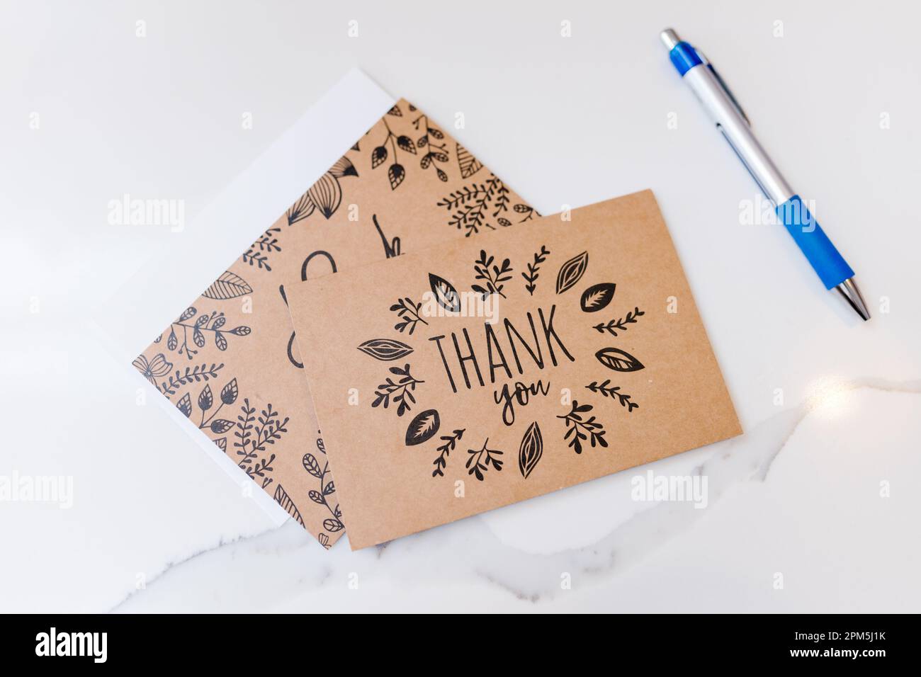 Brown and black boho thank you cards and pen Stock Photo