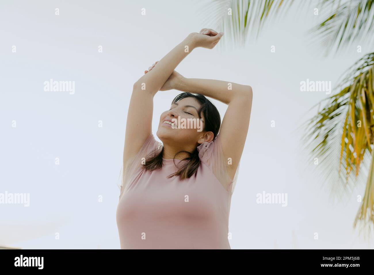 cute latin woman making relaxing expressions Stock Photo