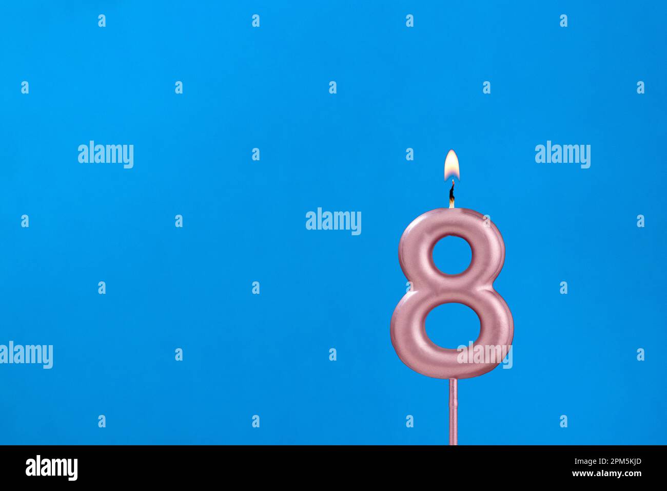 Candle number 8 Birthday in blues foamy background Stock Photo Alamy