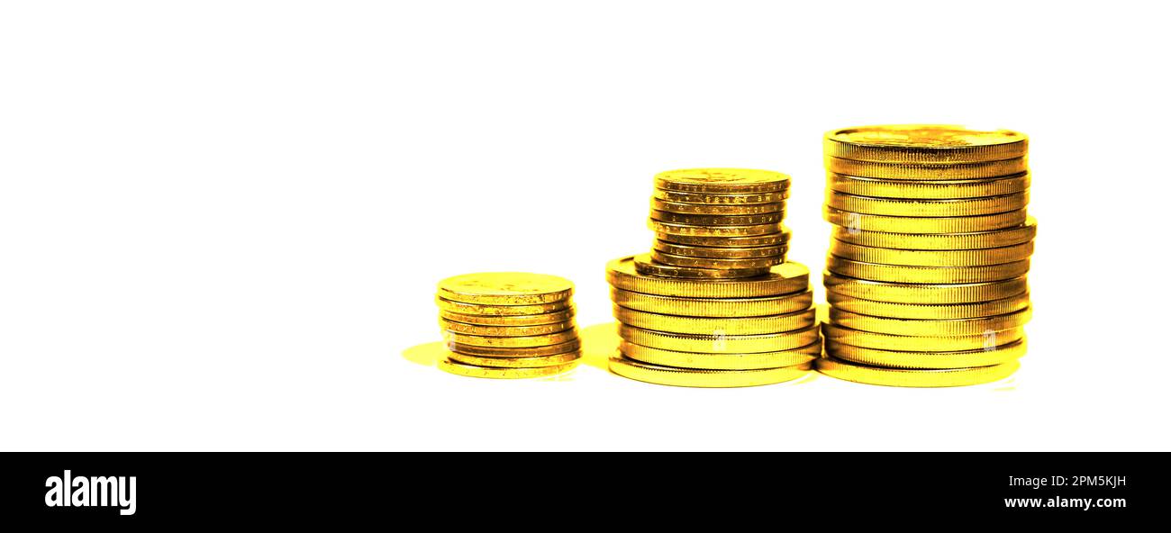 Pile of old gold coins stacked up representing wealth and riches success Stock Photo