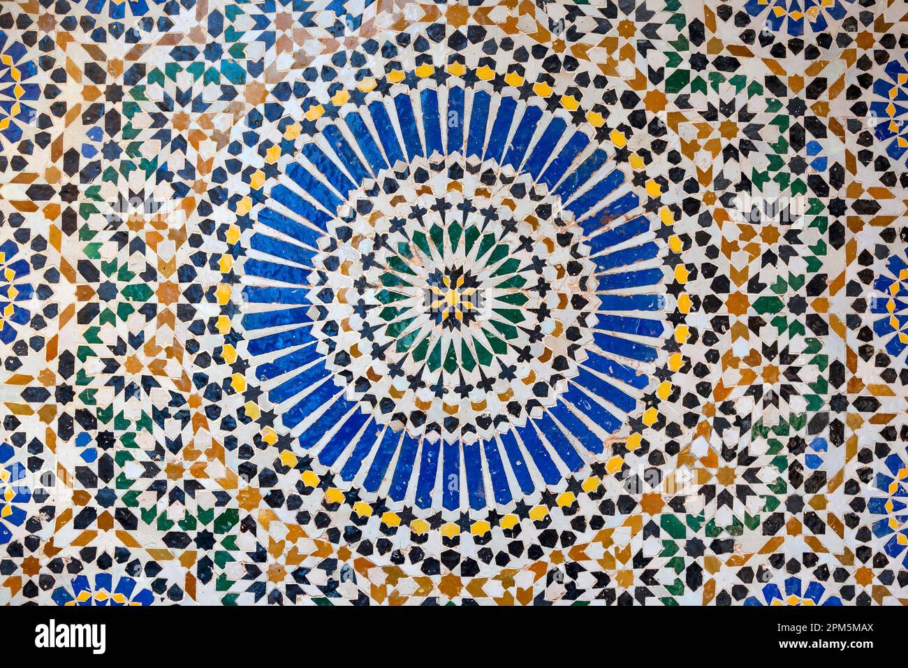 textures of ancient moroccan ceramic mosaic with geometric and floral pattern Stock Photo