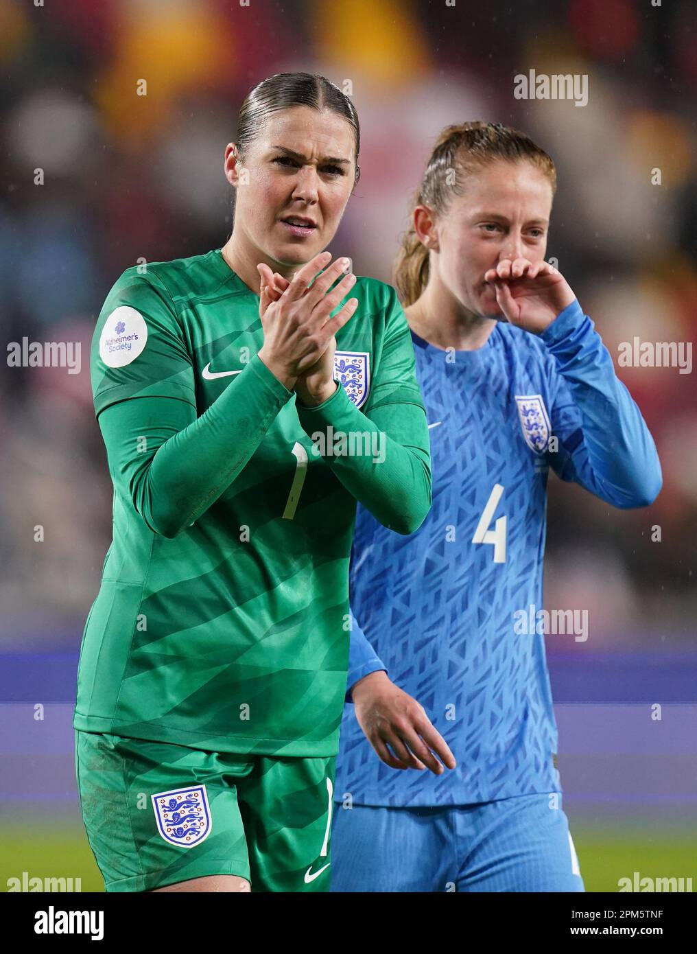 England goalkeeper Mary Earps (left) and Keira Walsh after the final whistle of the Alzheimer's Society International at the Gtech Community Stadium, Brentford. Picture date: Tuesday April 11, 2023. Stock Photo
