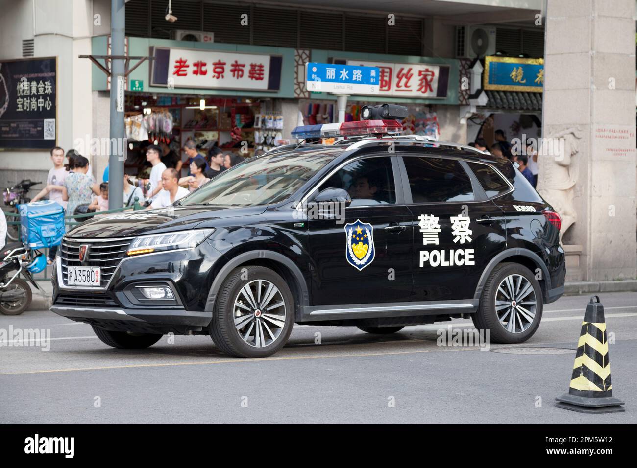 Shanghai, China - August 10 2018: Police SUV parked outside of Yuyuan market, Shanghai's popular tourist spot. Stock Photo