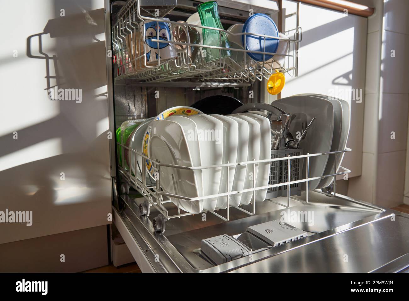 Side view of dishes and utensils in a dishwasher in a Spanish kitchen Stock Photo Alamy