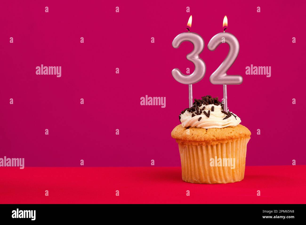 Candle number 32 - Cake birthday in rhodamine red background Stock ...