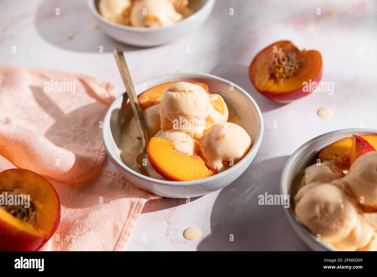 Nectarine Frozen Yogurt in three bowls Stock Photo