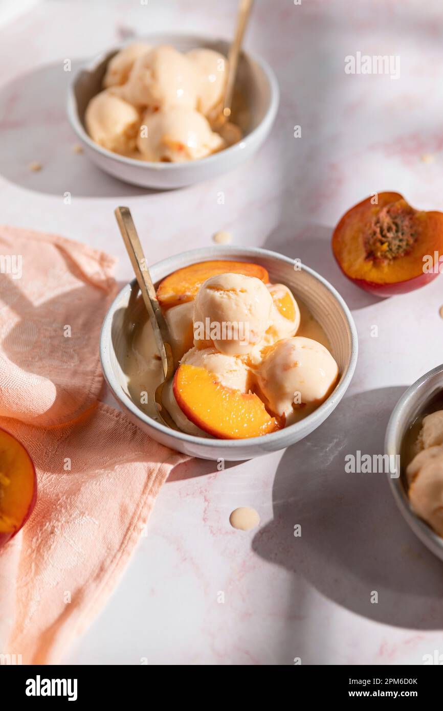 Nectarine Frozen Yogurt in three bowls Stock Photo