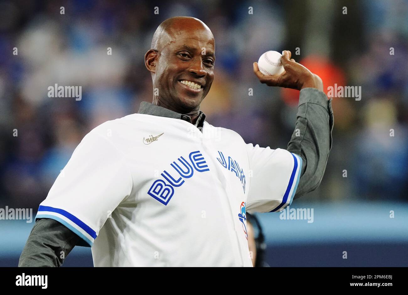 April 11, 2023, TORONTO, ON, CANADA: Former Toronto Blue Jays player Fred  McGriff throws out the ceremonial first pitch at the team's home opener  prior to MLB American League baseball action against