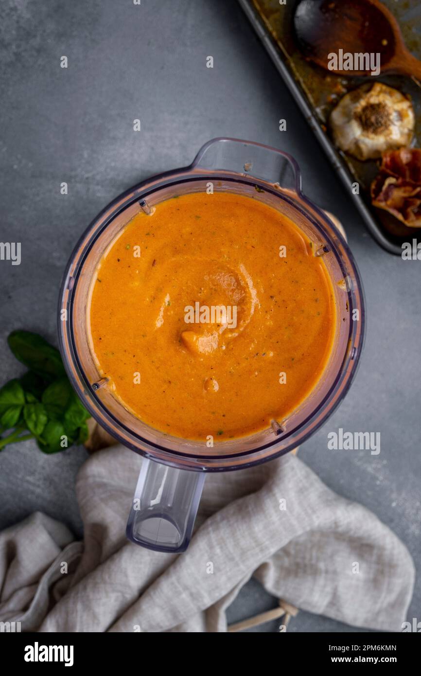 Roasted tomato soup pureed in a food processor container Stock Photo Alamy