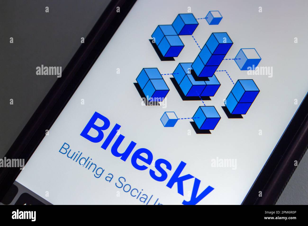 Website of Twitter alternative Bluesky Social seen in an iPhone screen. A decentralised social media protocol (Authenticated Transfer protocol) Stock Photo