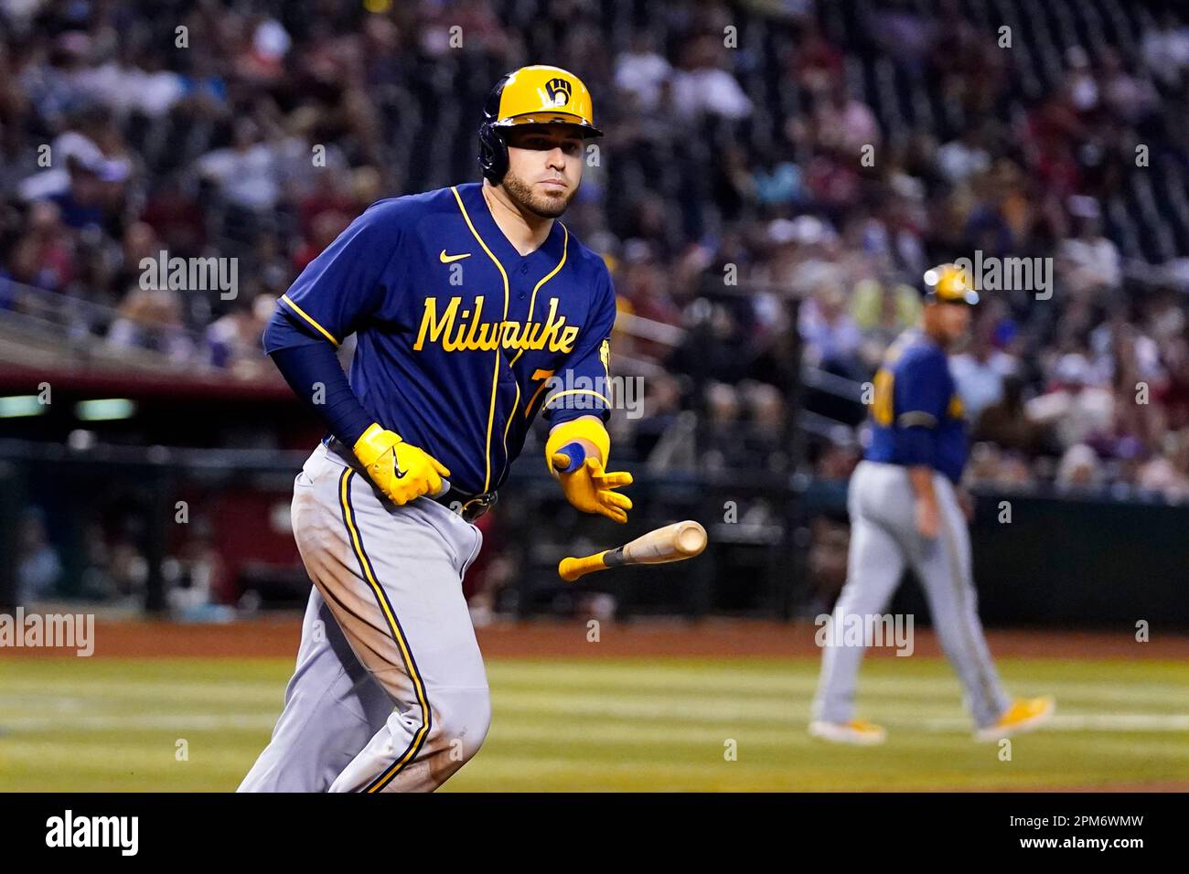 Milwaukee Brewers' Victor Caratini tosses his bat away on a baseloaded