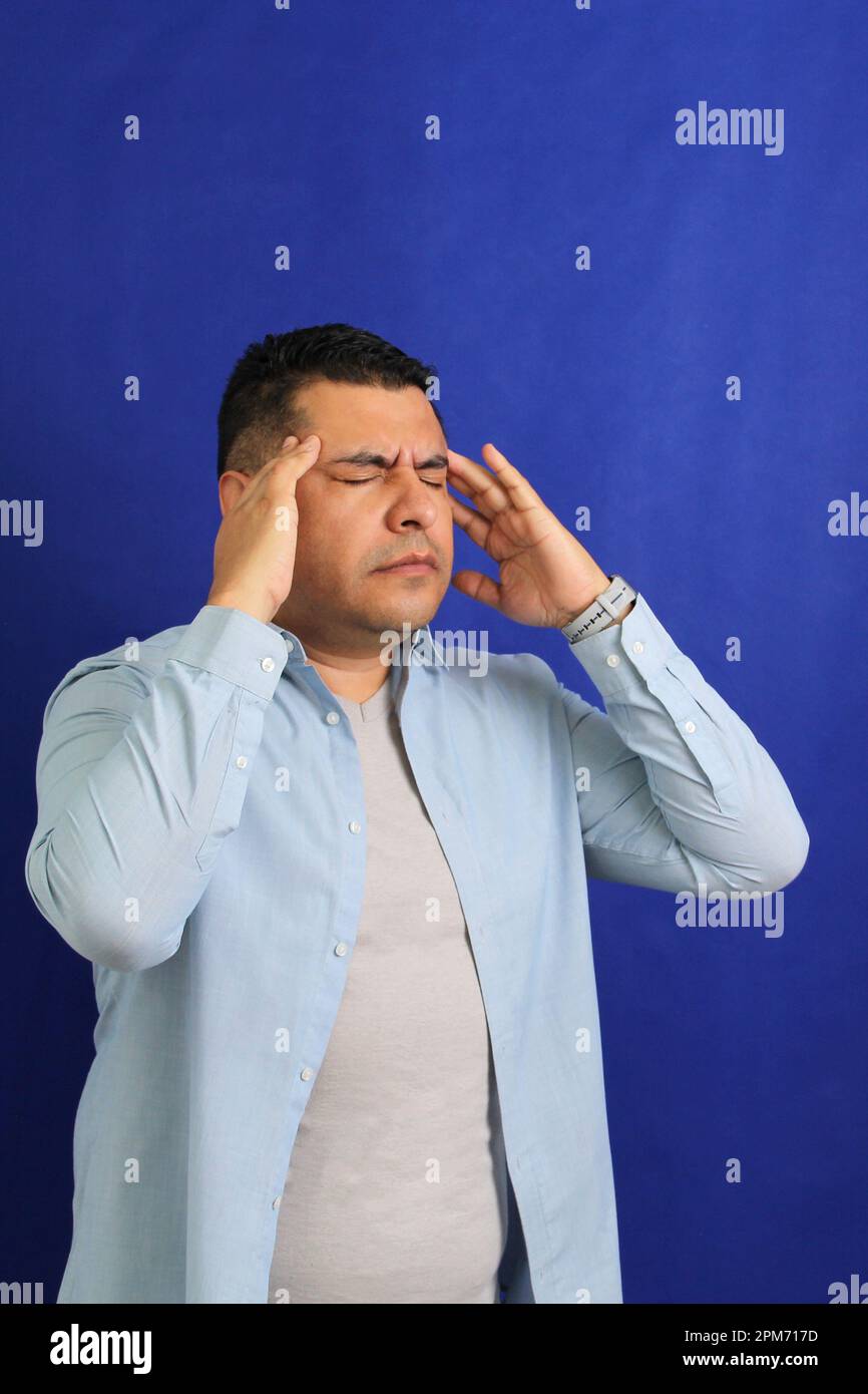 Forty year old brown latino adult man suffering from migraine disease
