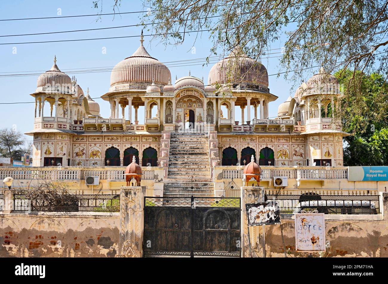 Colourful paintings on the outer wall of an old chhatri, converted in ...