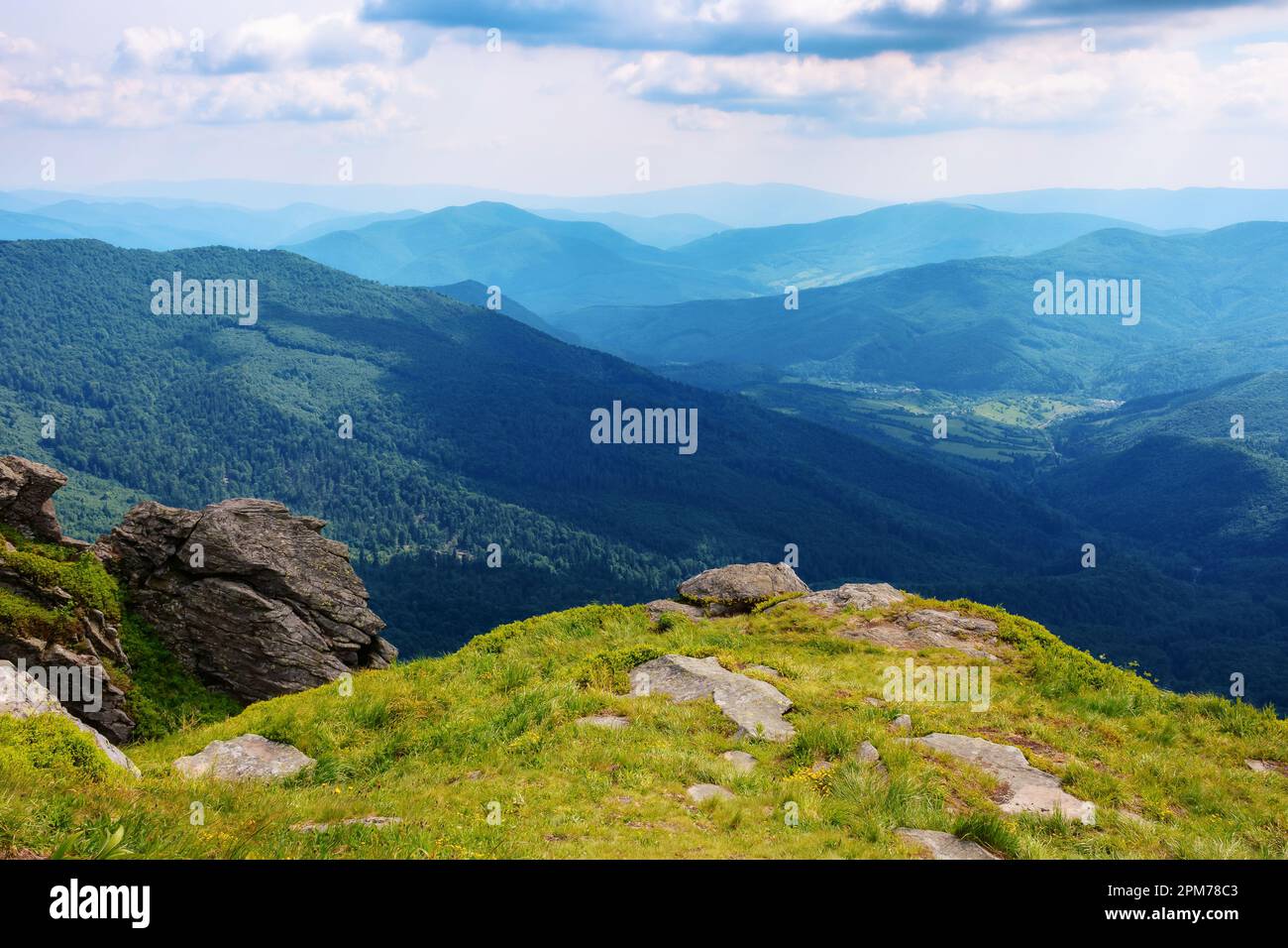 carpathian watershed ridge. stones and boulders on the green grassy hills. hot summer day Stock Photo