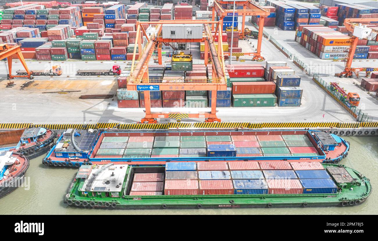 HUZHOU, CHINA - APRIL 12, 2023 - Aerial photo shows cargo ships loading ...