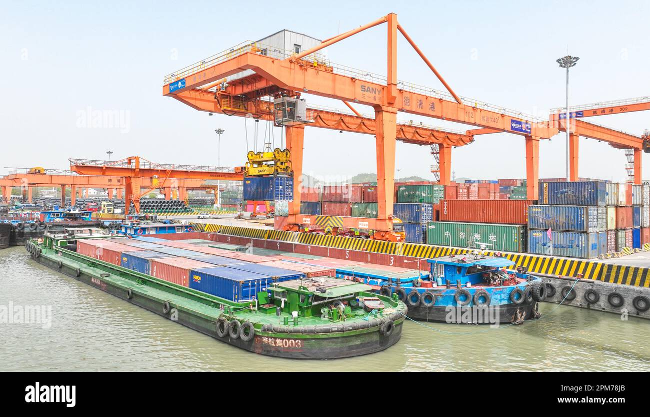 HUZHOU, CHINA - APRIL 12, 2023 - Aerial photo shows cargo ships loading ...