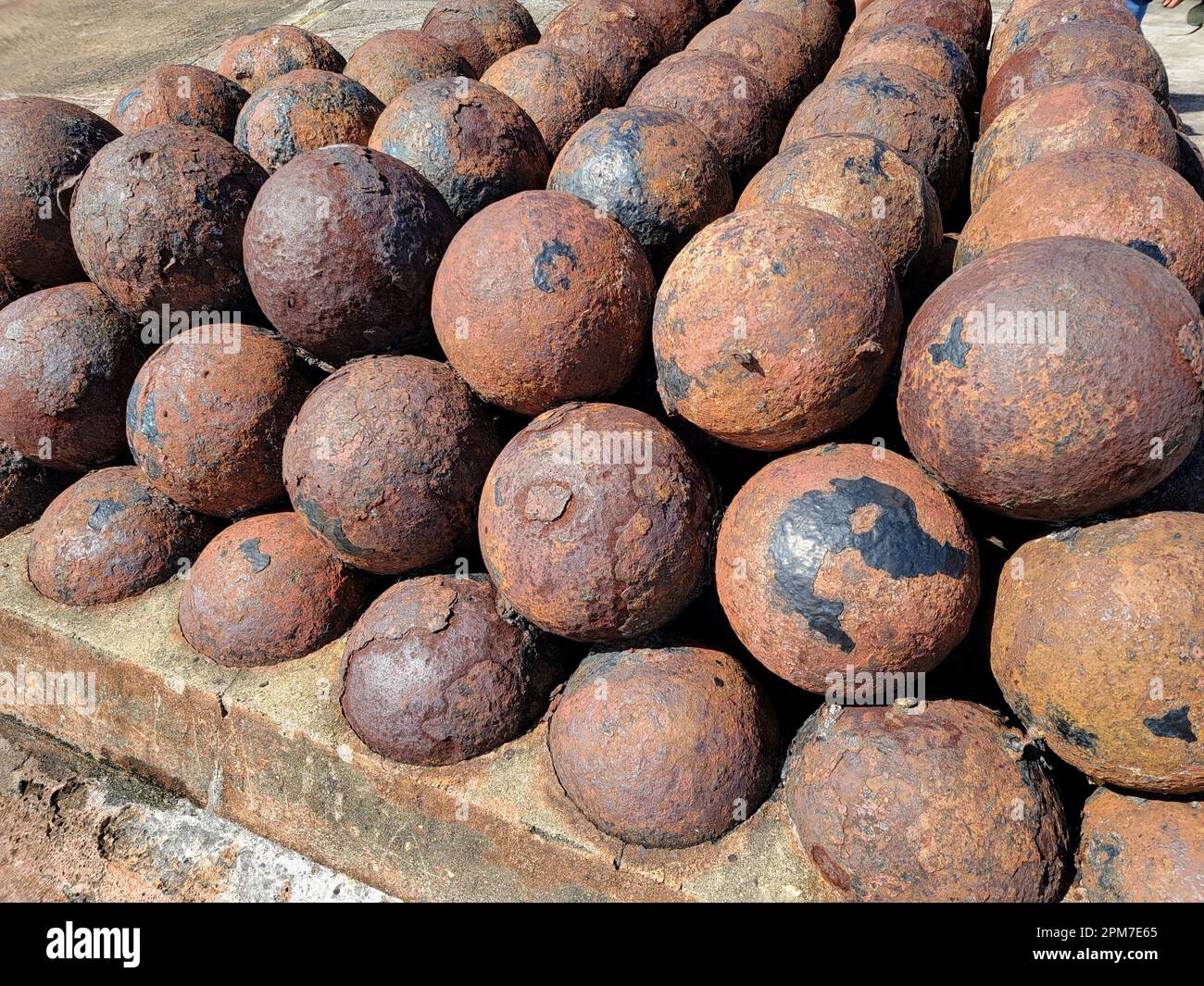 large pile or stack of rusted iron cannon balls Stock Photo Alamy