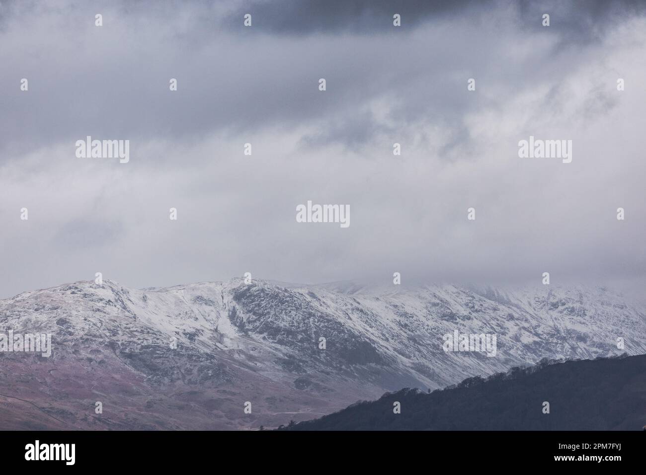 Lake Windermere, Cumbria, UK. 12th April  2023 .UK Weather Snow & hail on fells around   Lake Windermere   Credit: Gordon Shoosmith/ Live News Credit: Gordon Shoosmith/Alamy Live News Stock Photo