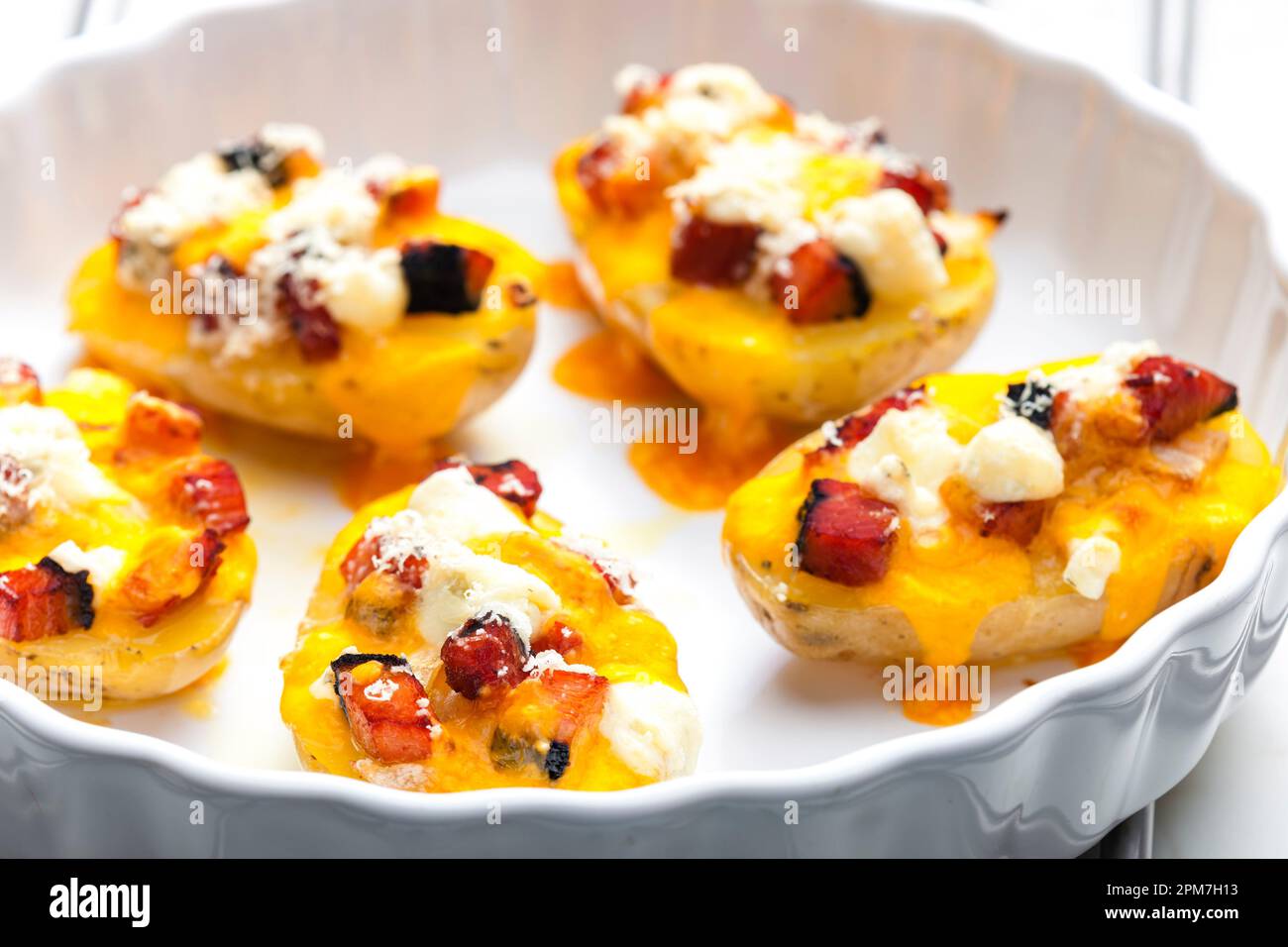 baked potatoes filled with cheese and bacon Stock Photo Alamy