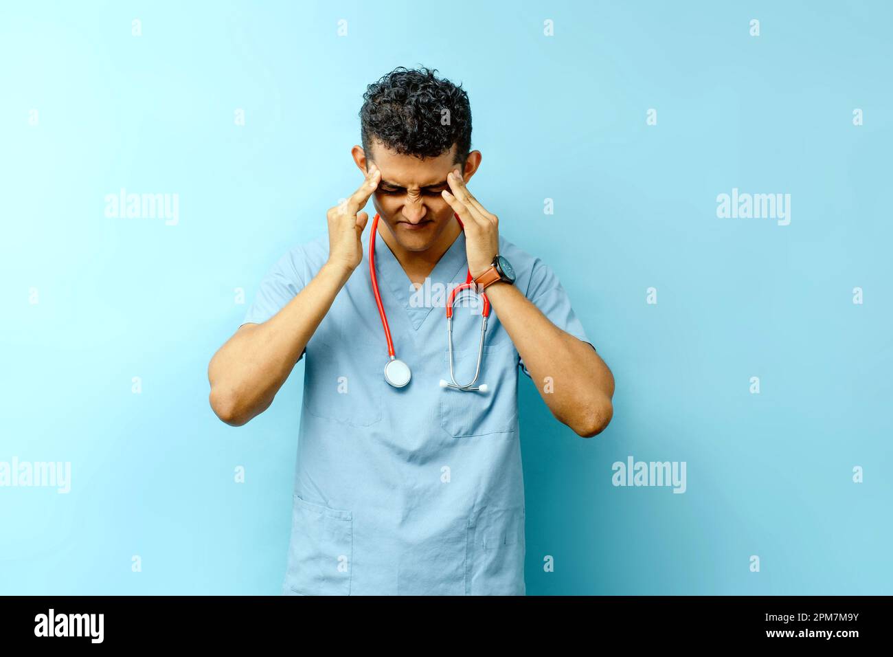Sad young doctor suffering hi-res stock photography and images - Alamy