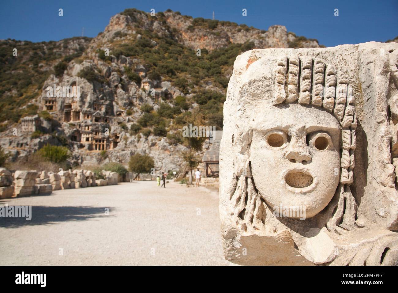 View of the carved stone faces around the ancient amphitheatre ruins of