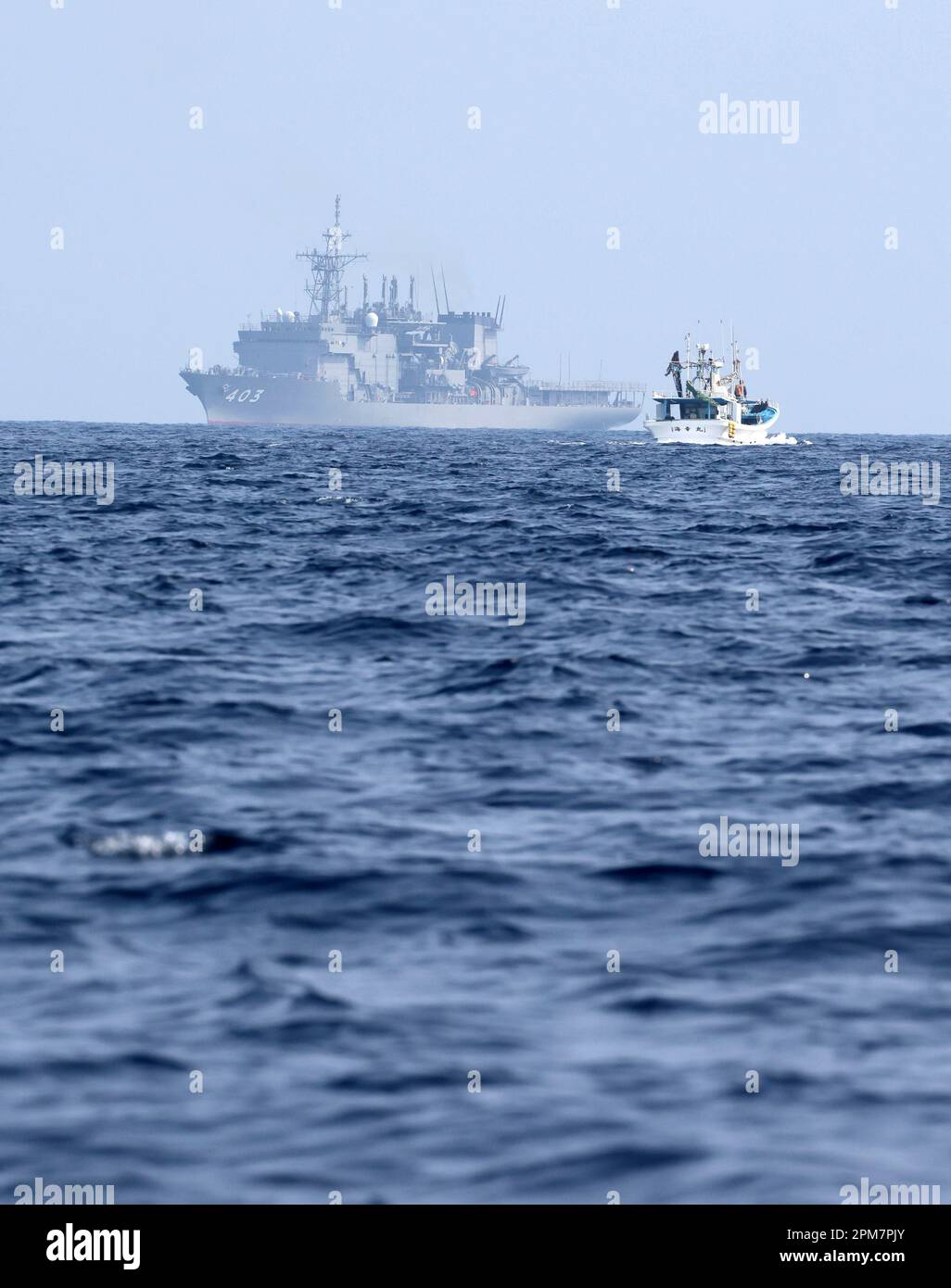 JS Chihaya (background), a submarine rescue ship of Japan Maritime Self ...