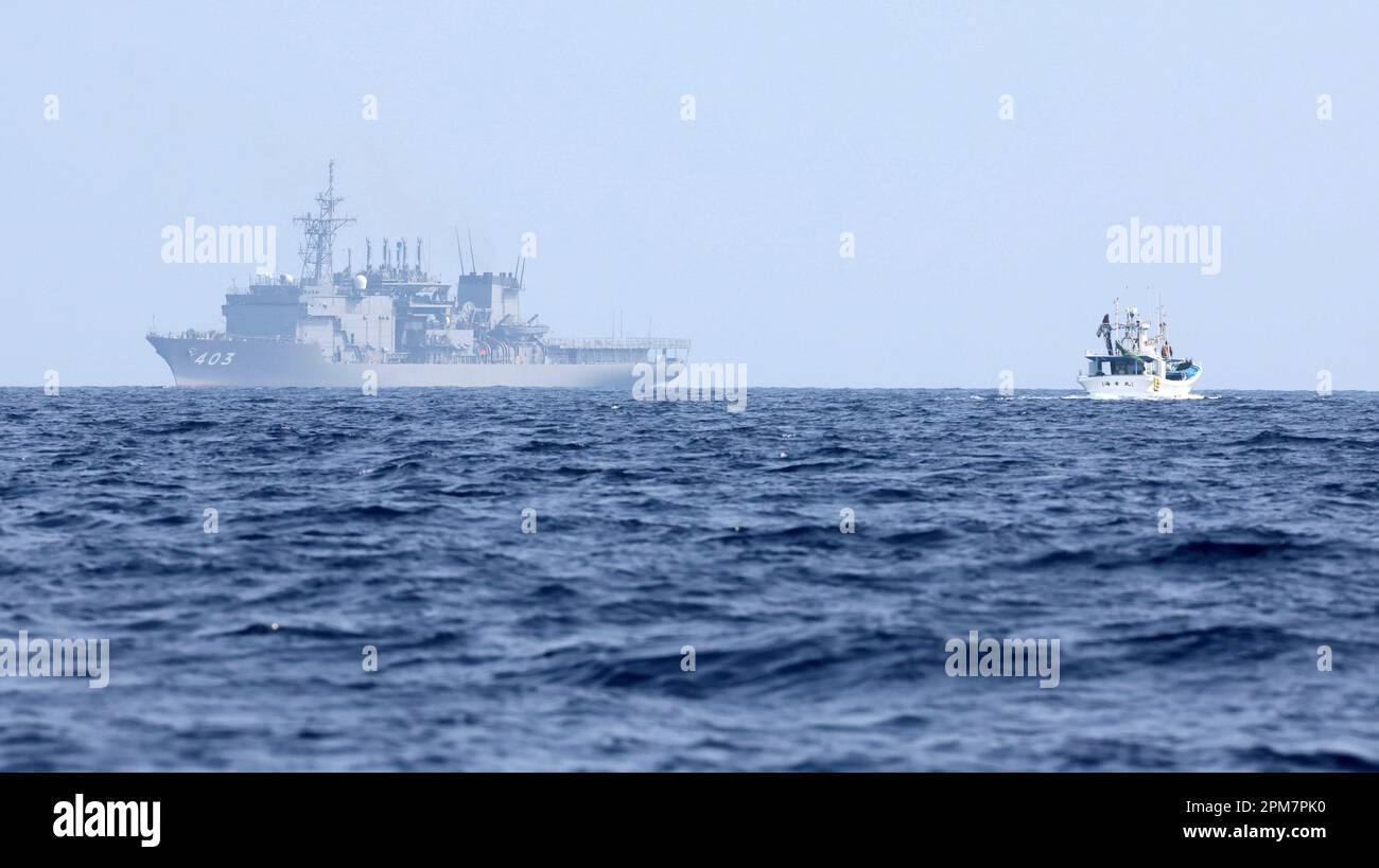 JS Chihaya (background), a submarine rescue ship of Japan Maritime Self ...