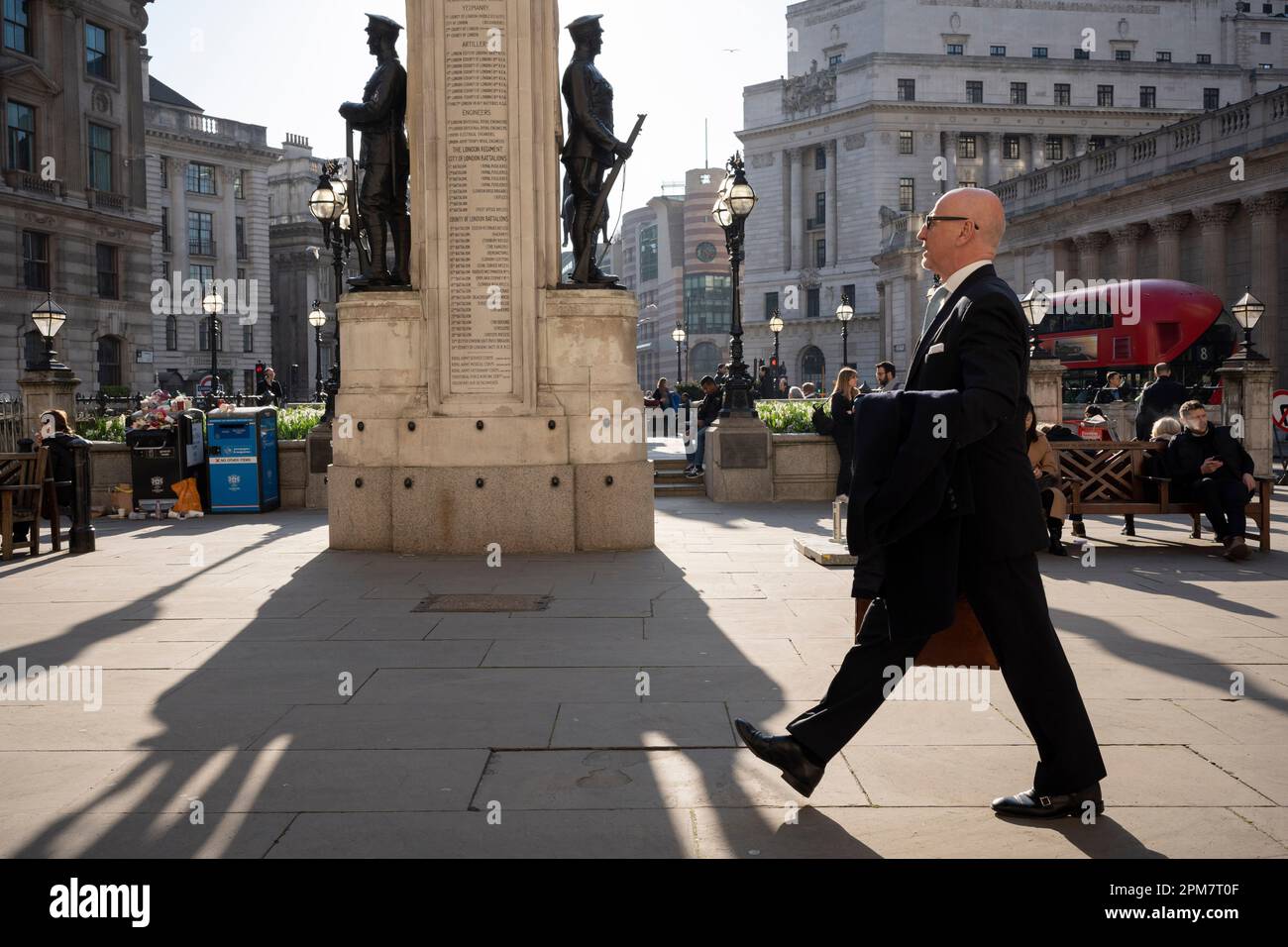 City workers and visitors to London walk past the war memorial to those killed in the First World War, in the City of London, aka the Square Mile - the capital's financial district, on 4th April 2023, in London, England. Stock Photo