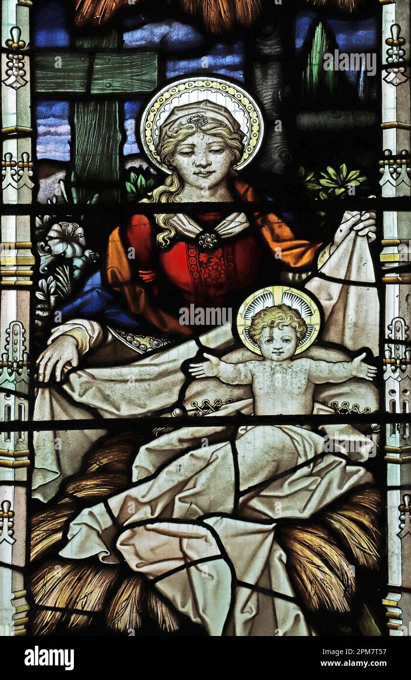 Stained glass window by Percy Bacon depicting the nativity, Church of St John the Evangelist, Skirwith, Cumbria Stock Photo