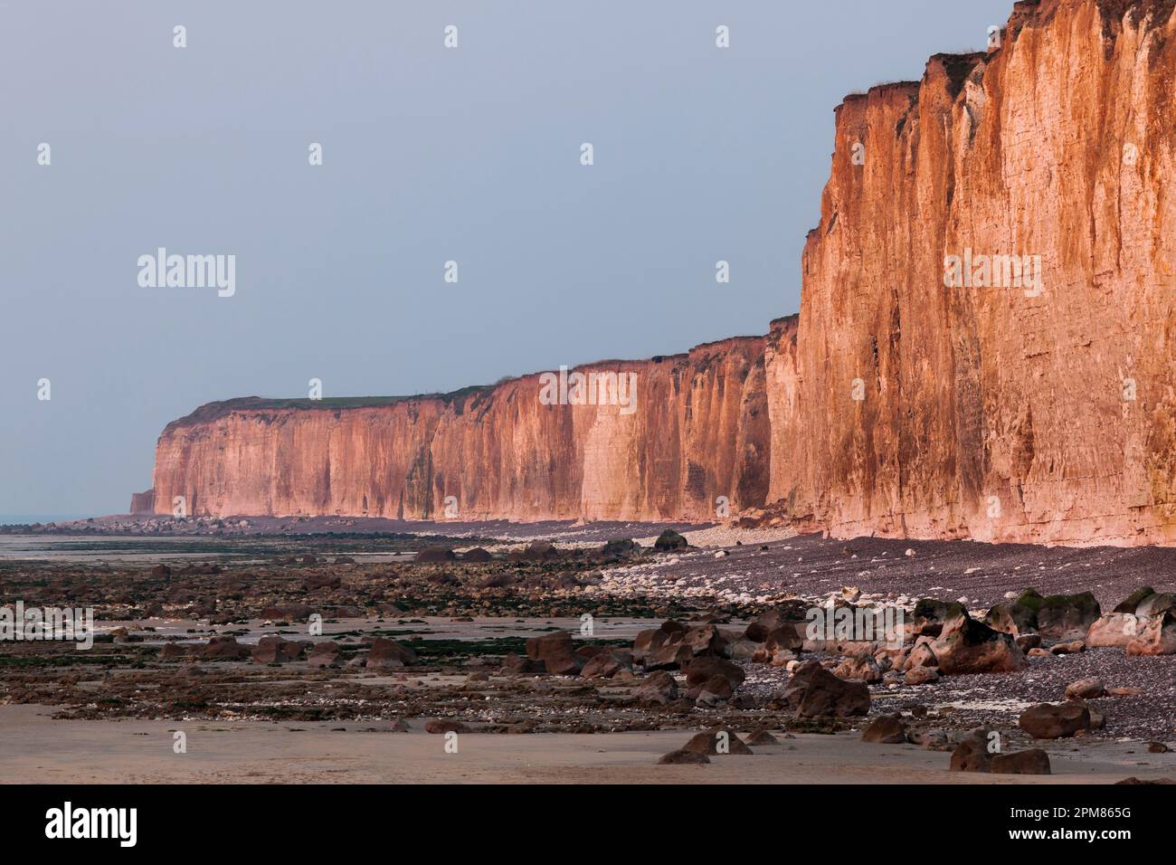 France, Seine-Maritime, Veules-les-Roses, listed as one of the Most Beautiful Villages of France, seaside, sunset making the chalk cliffs glow in red Stock Photo