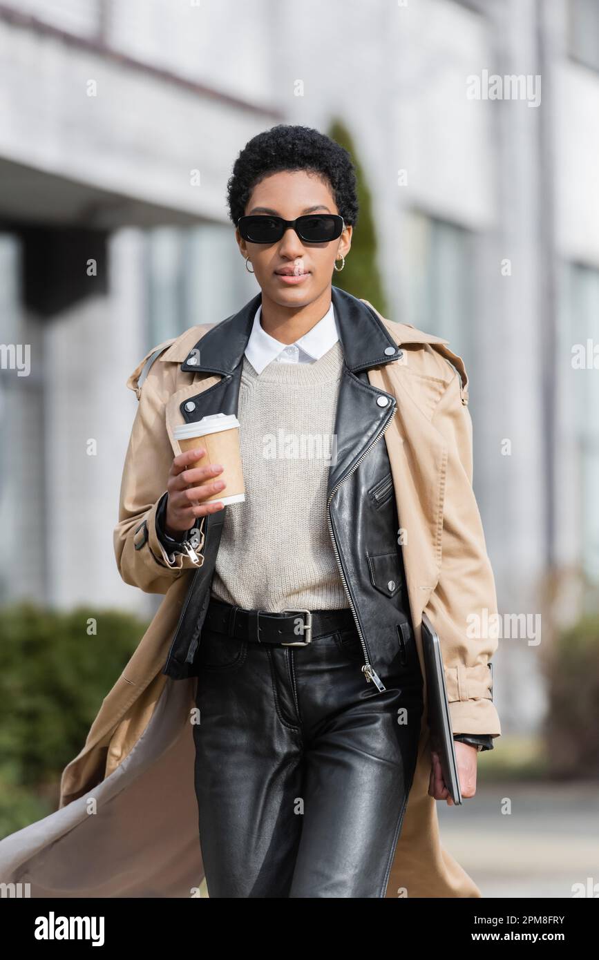 Foto de pretty girl in black sweater and leather pants do Stock