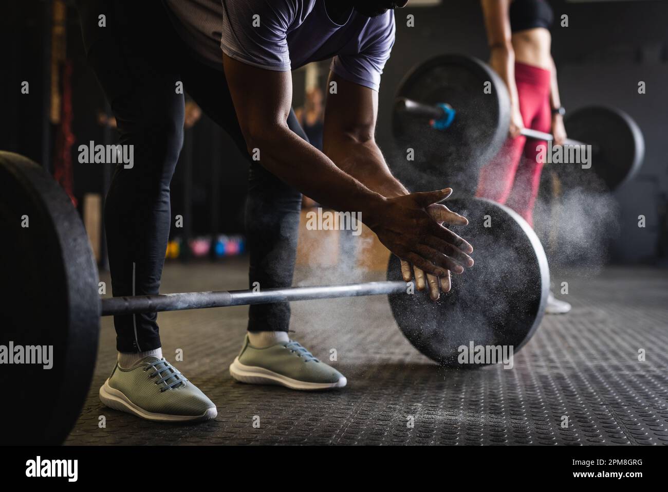 Dumbbell chalk powder man hi-res stock photography and images - Alamy