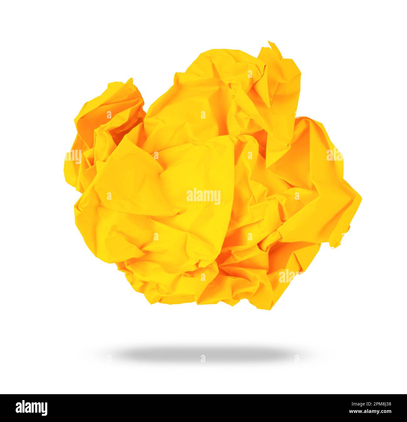 Yellow colored crumpled paper rolled into a ball, isolated on a white