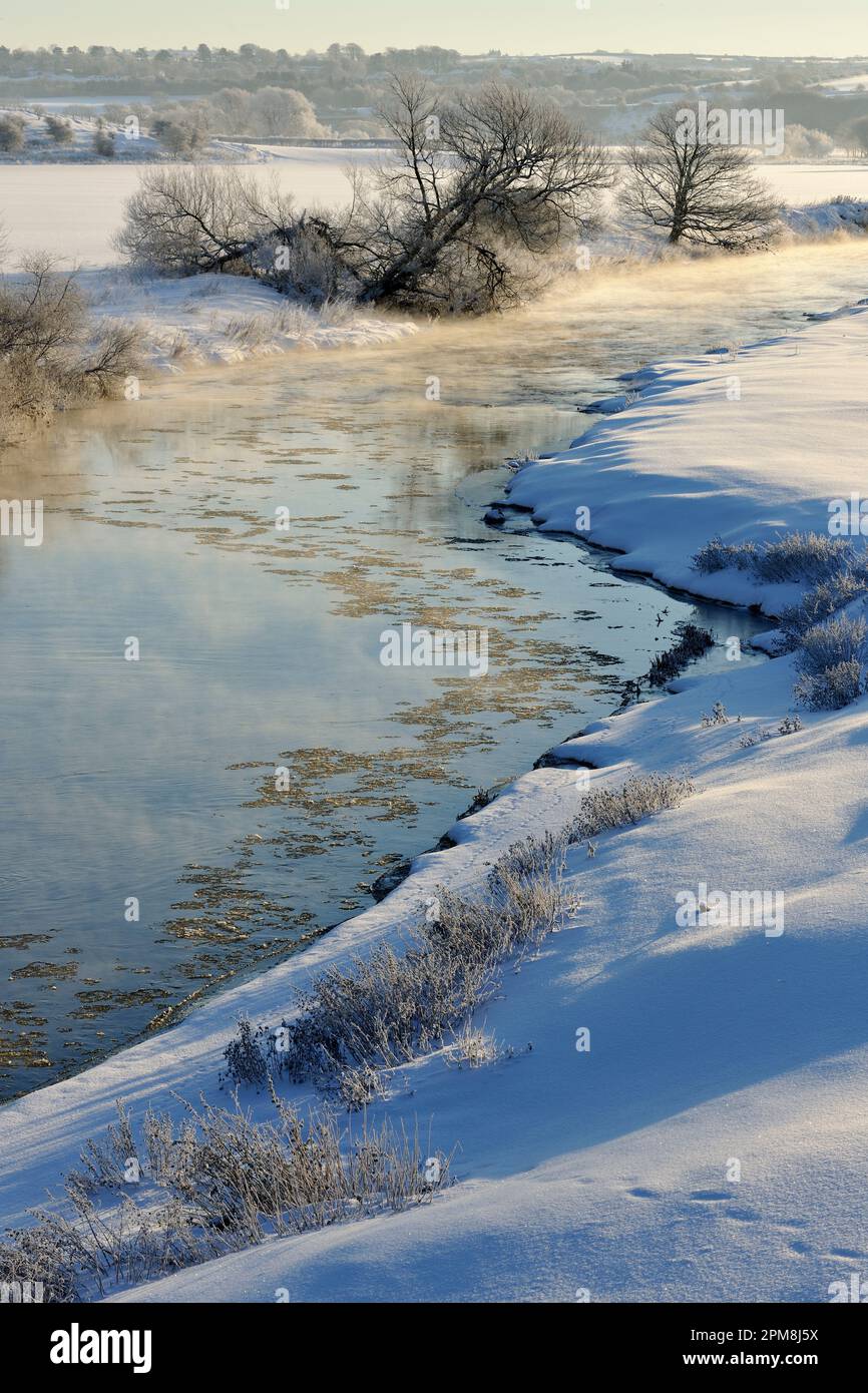 River Whiteadder in early morning light with steam rising from surface due to the temperature difference between the water and air Stock Photo