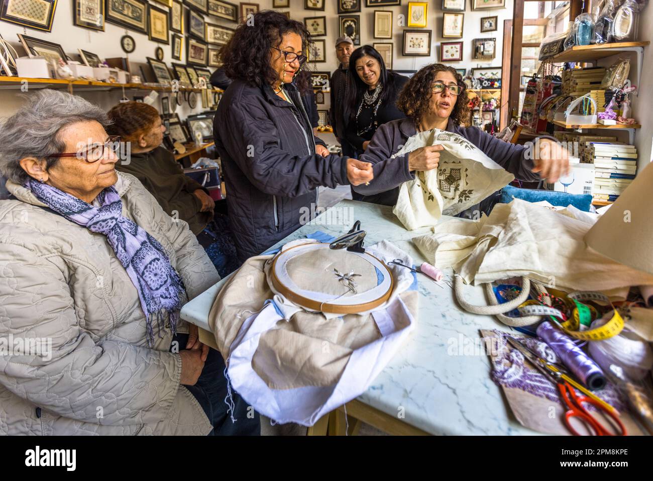 In a workshop behind the market hall in the northern part of Nicosia, women learn the ancient craft of embroidery. Nicosia Municipality, Cyprus Stock Photo