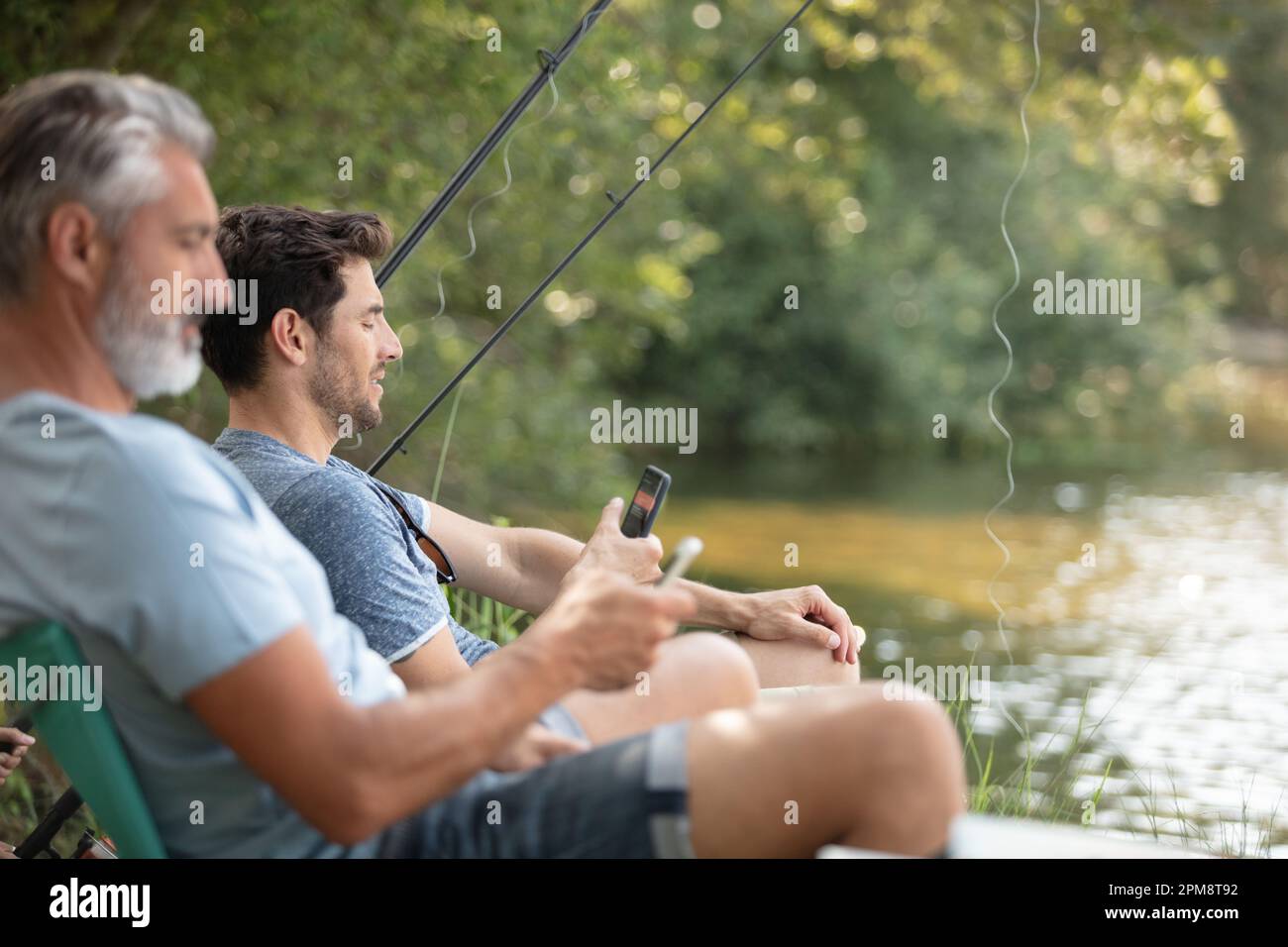 Two people peacefully fishing hi-res stock photography and images - Alamy