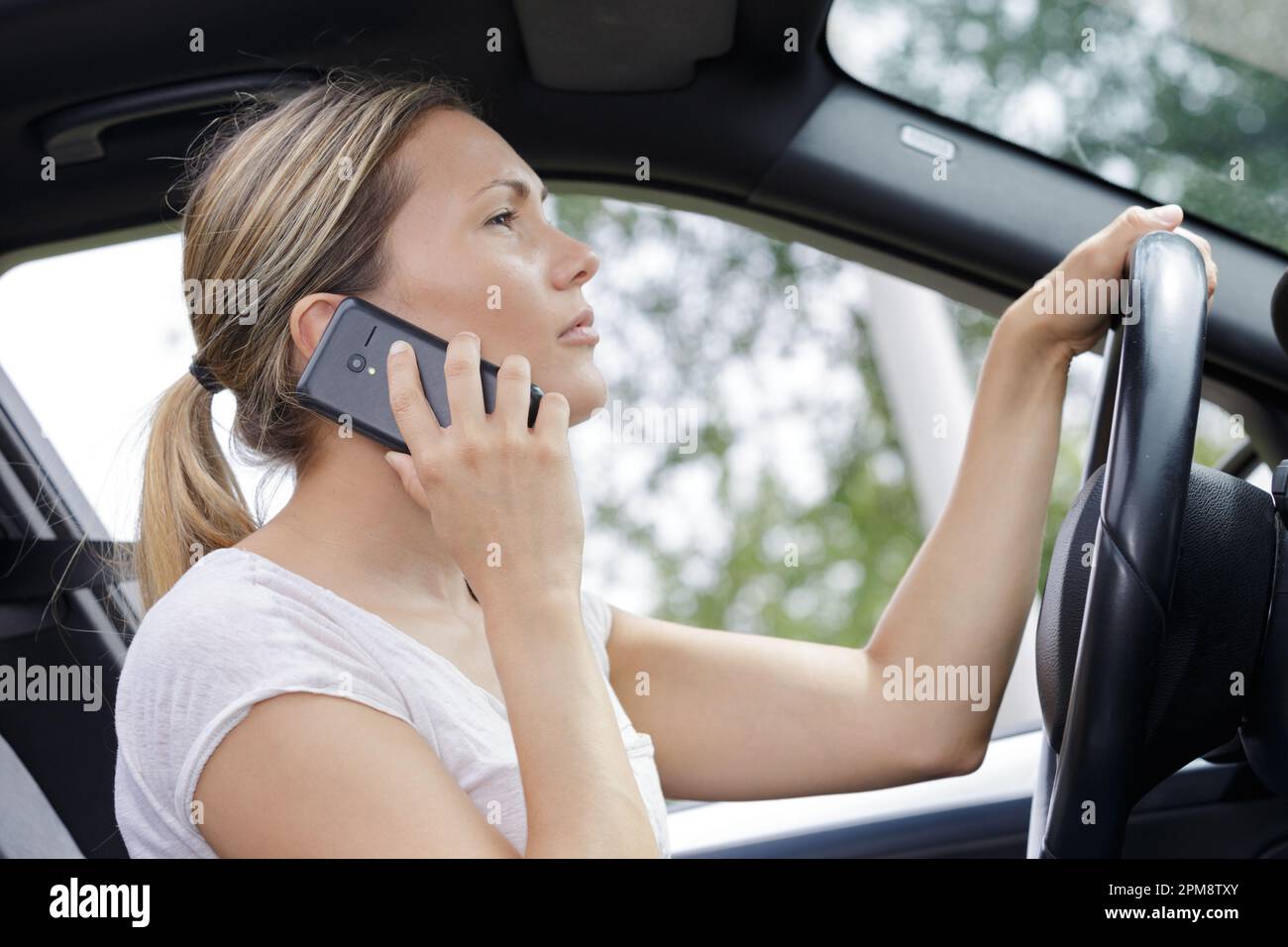 Answering call in car hi-res stock photography and images - Alamy