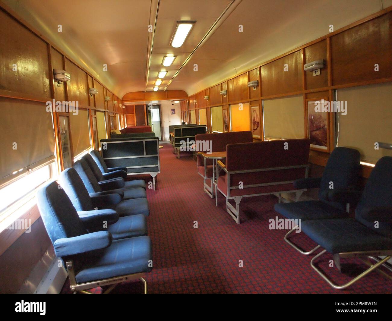 Interior of old-style US railroad passenger cars showing the luxurious amenities of the day. Stock Photo
