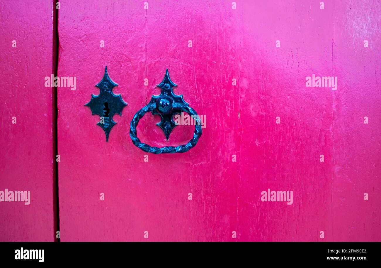 Vintage Padlock with Handle on a Pink Textured Background. Stock Photo