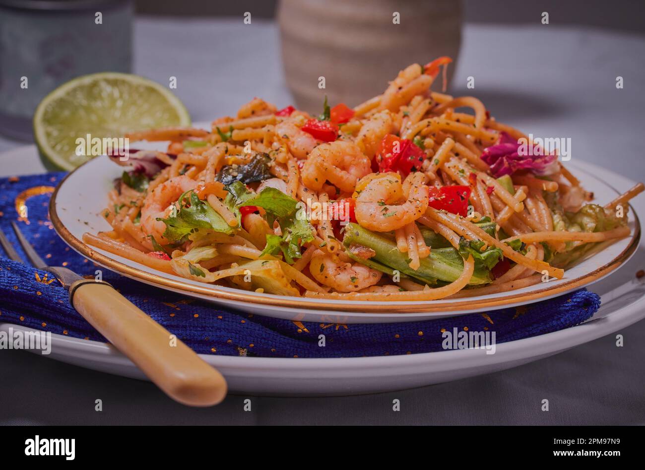 Prawn pasta dish with vegetables ,herbs and spices. Stock Photo