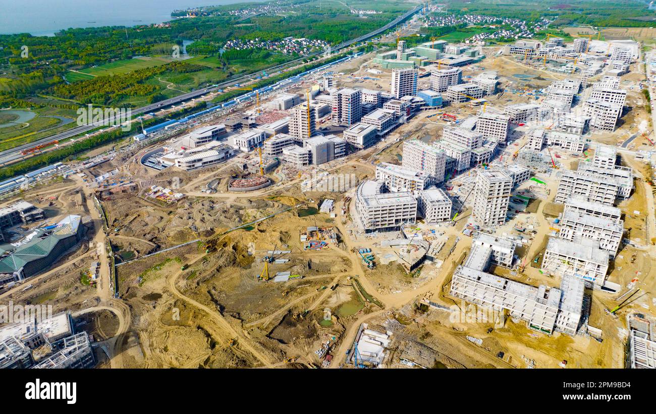SHANGHAI, CHINA - APRIL 12, 2023 - Builders, along with hundreds of ...