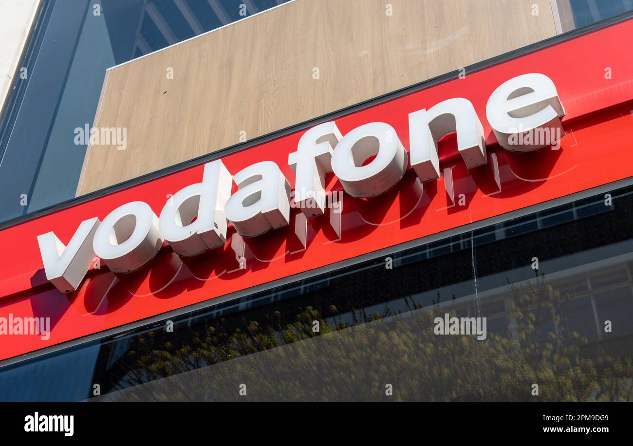 London. UK- 04.09.2023. The name sign of a retail branch of Vodafone on Oxford Street. A British national mobile network and internet service provider Stock Photo