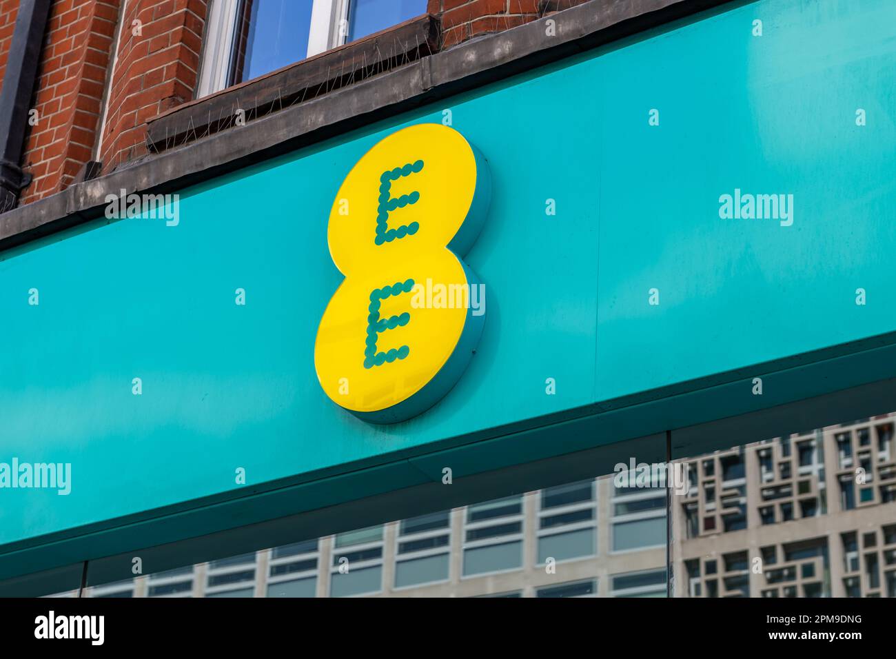 London. UK- 04.09.2023. The name sign of a retail branch of EE on Oxford Street. A British national mobile network and internet service provider. Stock Photo