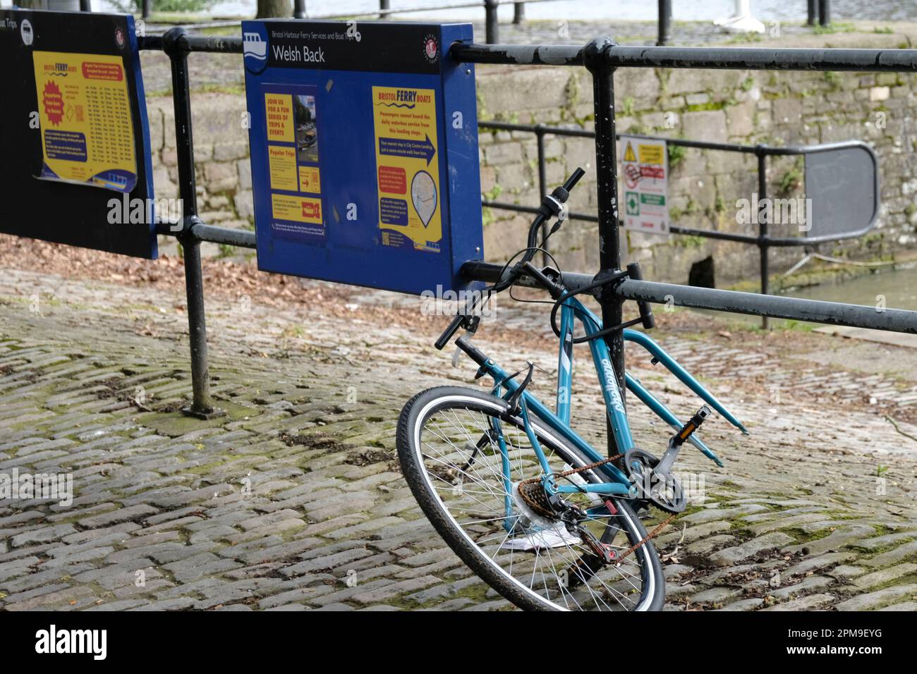 Bicycle without fron wheel tied to the railings Welsh Back Bristol UK