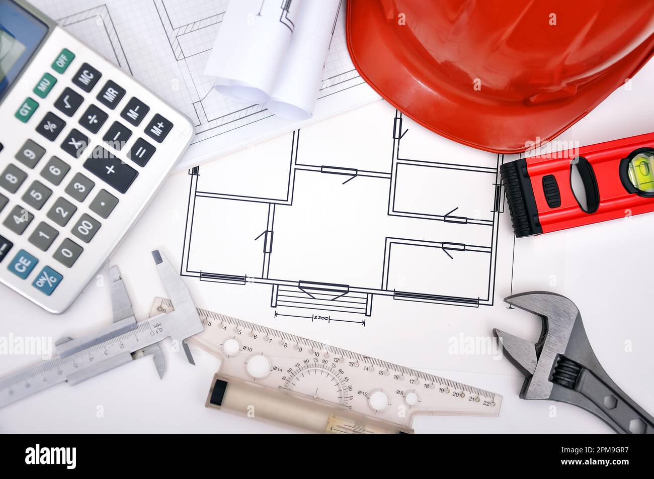 blueprint, calculator and tools on the desktop Stock Photo