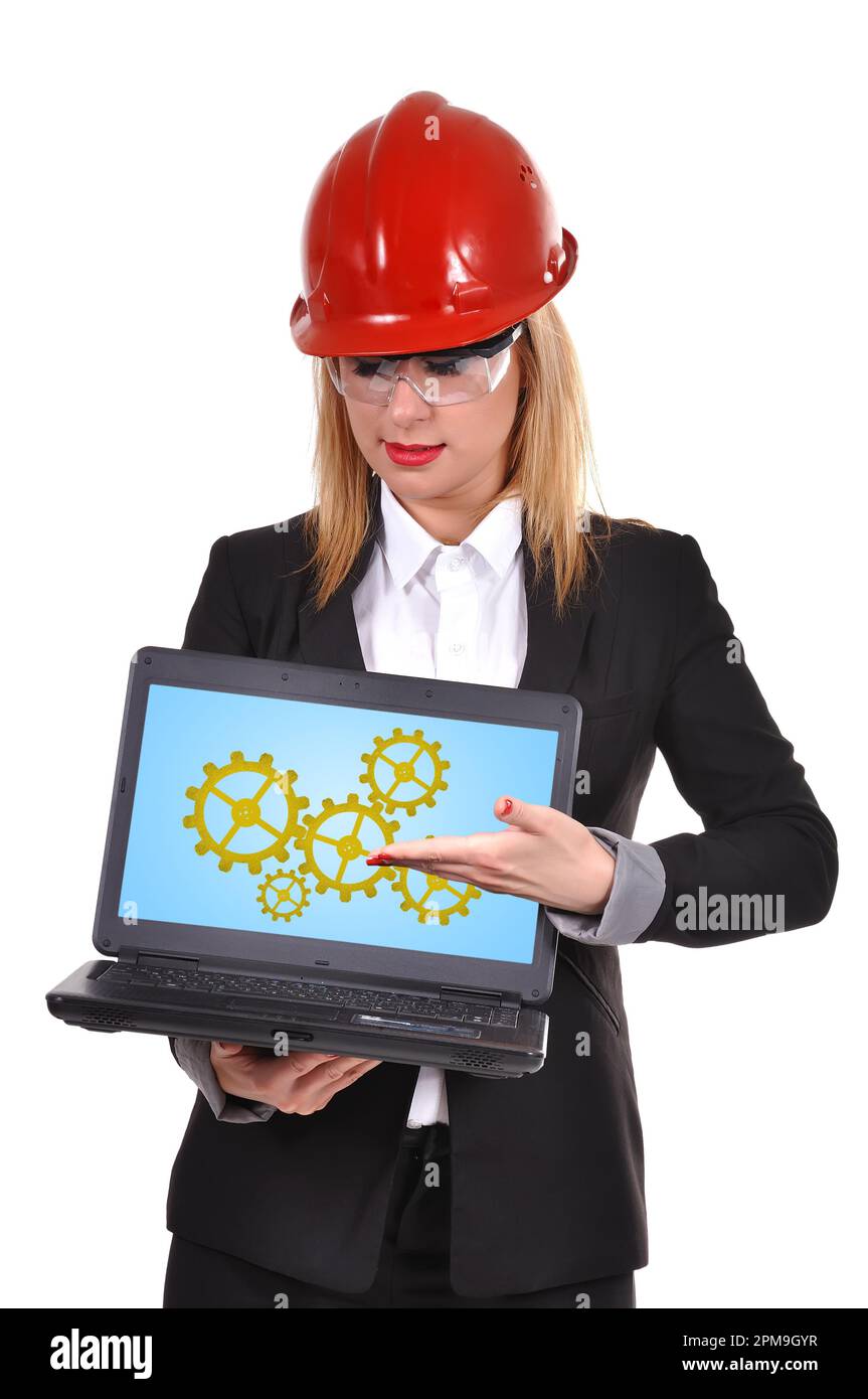 woman engineer holding laptop with gold gears Stock Photo