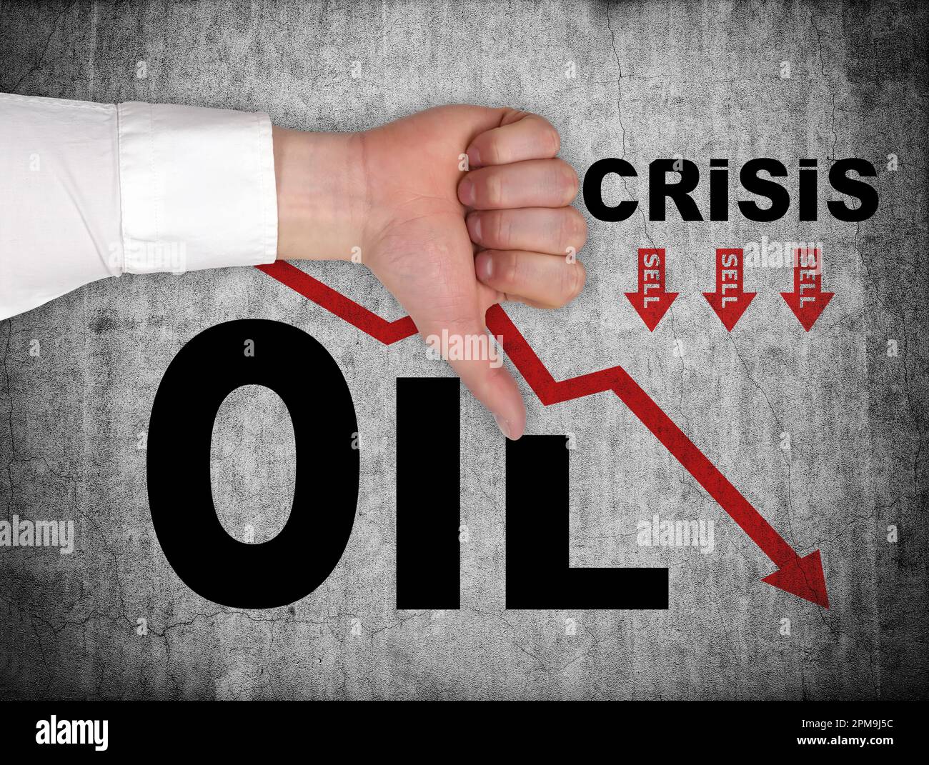 hand showing dislike sign and drawing falling oil chart on wall Stock Photo