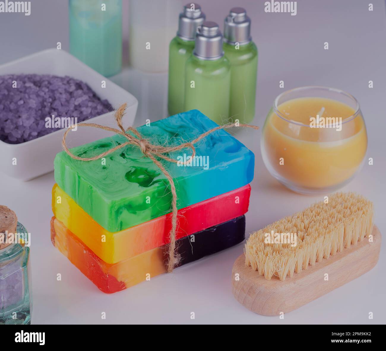 Mixed beauty products on a white bathroom surface. Stock Photo
